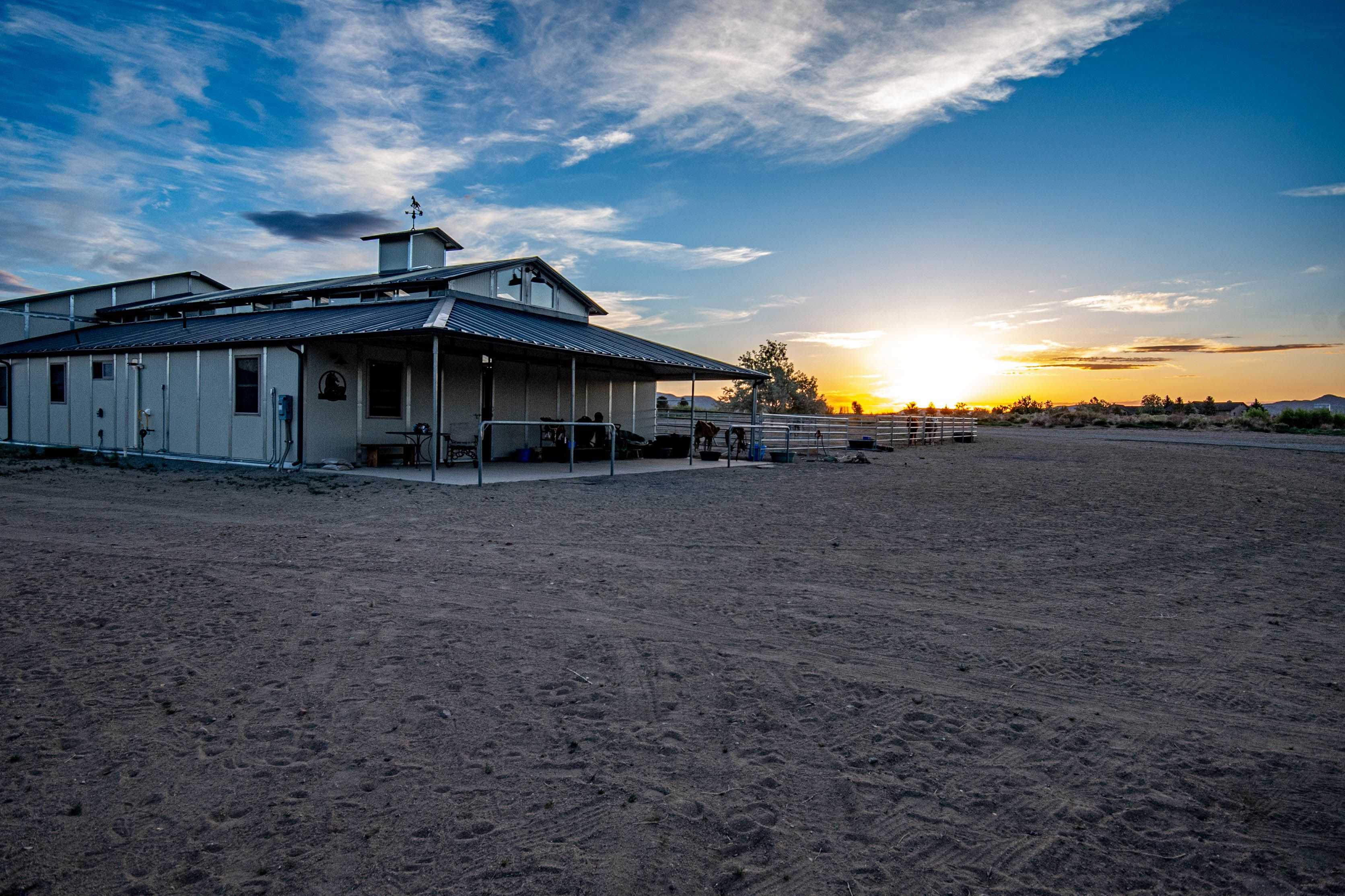 Barn apartment building at sunset with covered patio